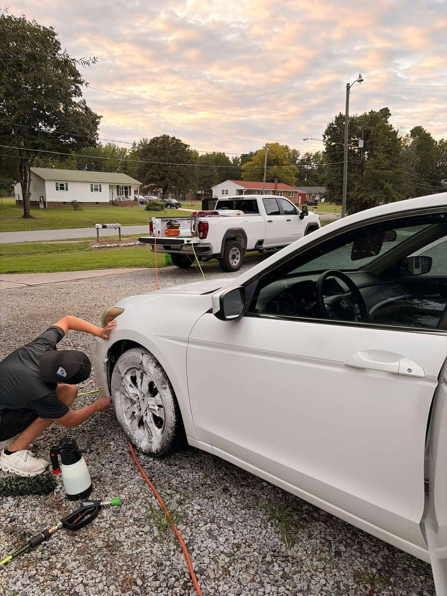 Hand washing a Honda Accord during a mobile detail